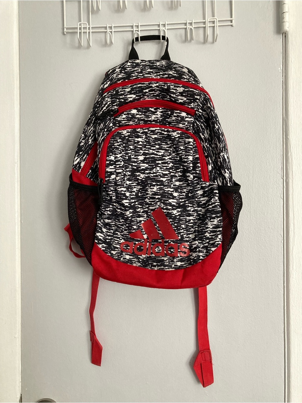 Adidas schoolbag black/white print, w/ red details. Used lightweight but sturdy